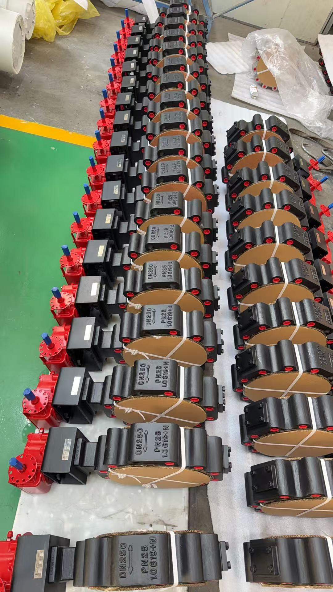 Batch of DN250 PN25 triple offset butterfly valves lug type painted black with electric actuators ready for European export